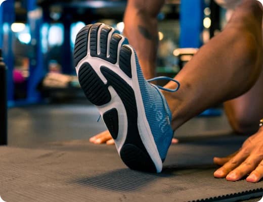 Woman in Peluva five-toe shoes performing a movement showing foot functionality