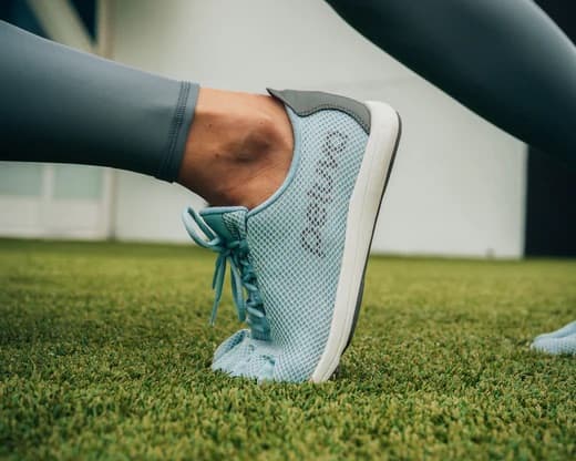 Feet in Peluva shoes performing a movement that shows full foot functionality