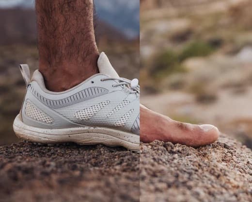Close-up of Peluva five-toe shoes on natural terrain, showing groundfeel