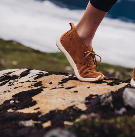 Woman walking outdoors in Peluva five-toe shoes feeling the ground
