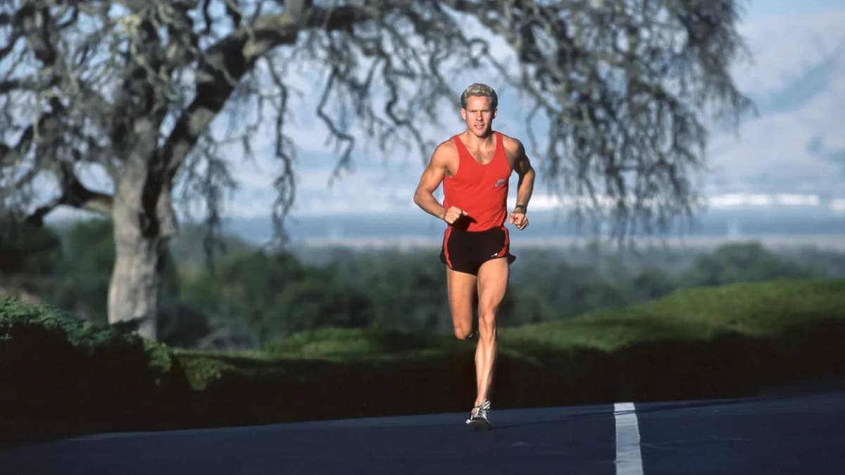 Archival photo of Mark Sisson competing in a marathon during his elite running career