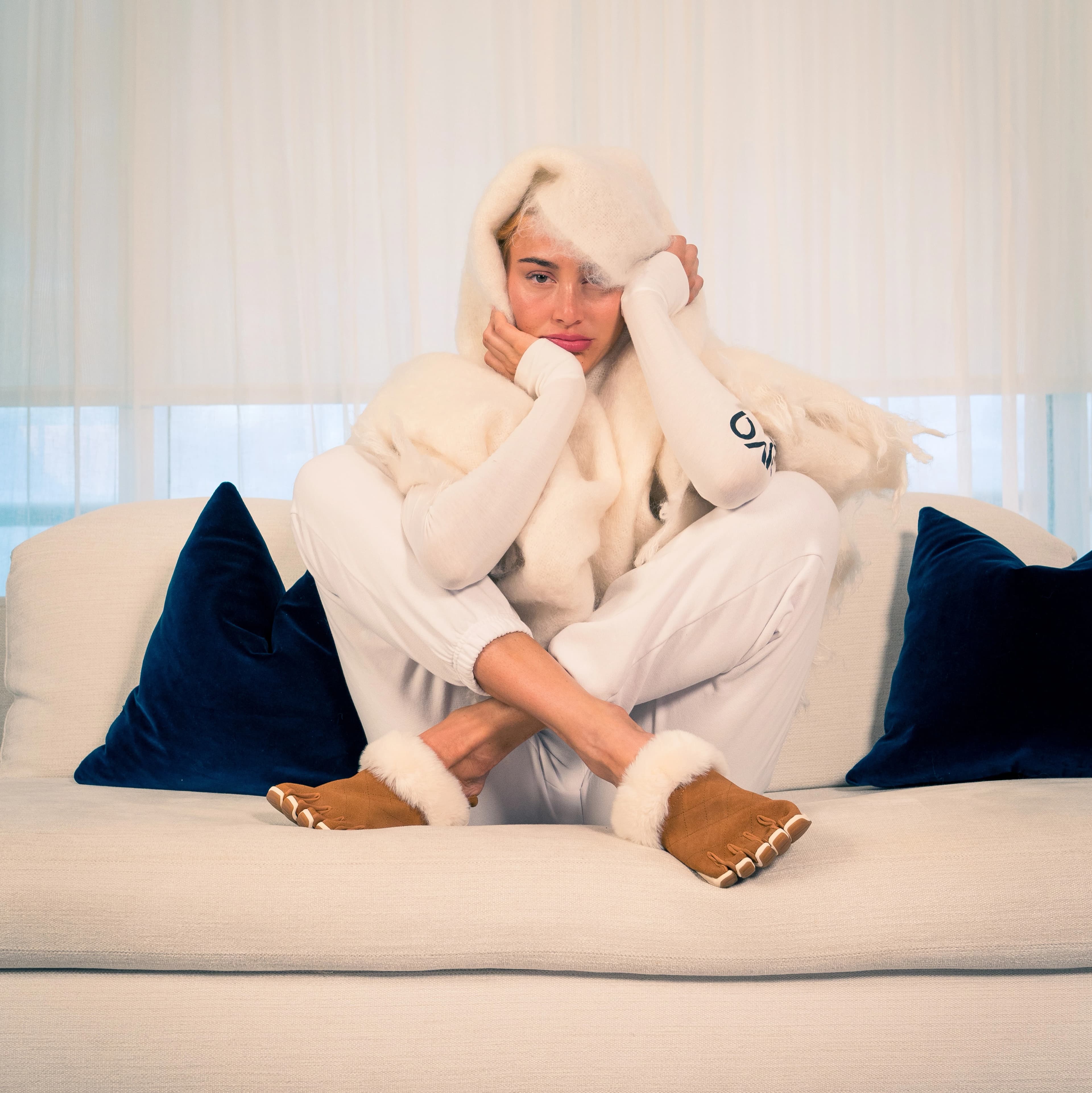 Person wearing Peluva slip on shoes at home