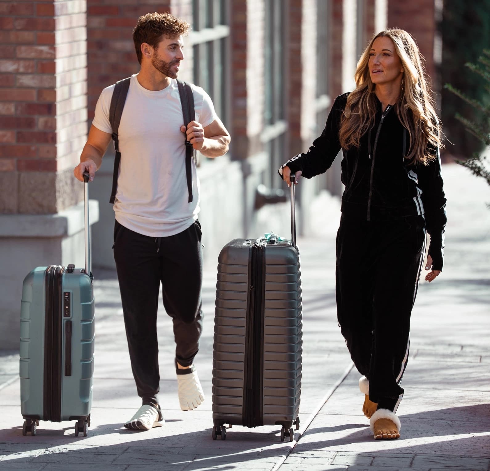 People wearing Peluva shoes stepping onto a concrete sidewalk